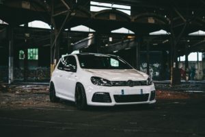 white bmw m 3 parked on parking lot during night time
